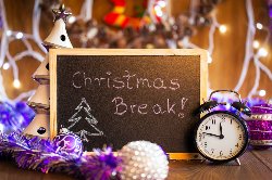 \"Christmas Break\" on chalk board with seasonal decorations